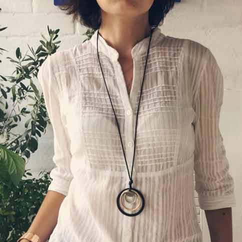 Woman-Wearing-Linen-Shirt-Art-Deco-geometric-necklace-Mayfairtrends