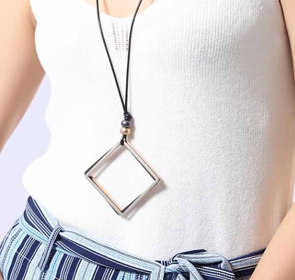 closeup-detailed-view-woman-white-tshire-wearing-Mayfair-Chic-Trio-Square-Necklace